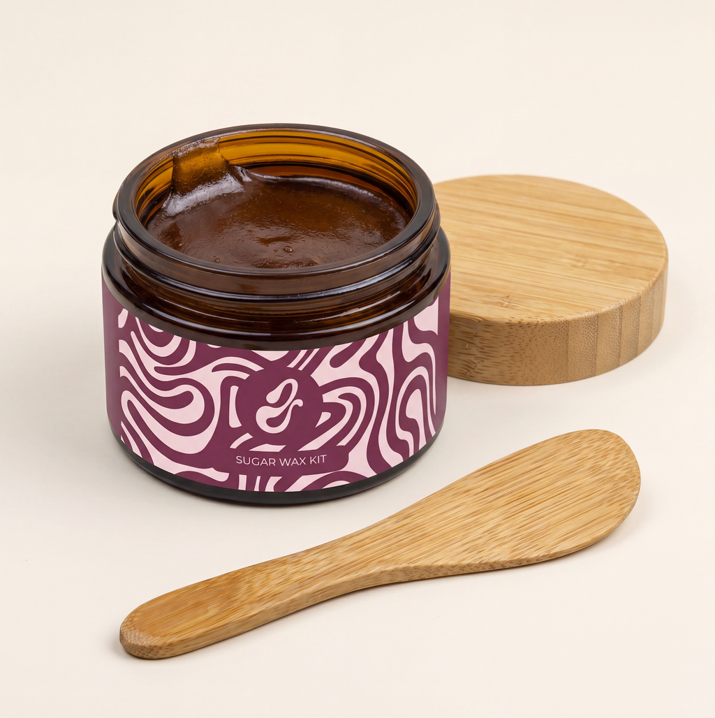 Sugar wax applied to leg with bamboo spatula